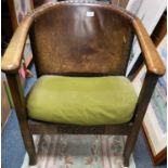An EDWARDIAN TUB STYLE CHAIR with feature original leather back
