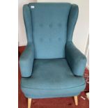 A modern (only a couple of years old!) easy lounge chair in blue fabric with nice light ash legs -