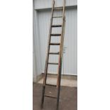 A nice set of vintage wooden extending 9 step ladders extending a further 9 steps