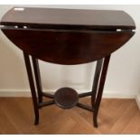 A vintage small drop-leaf side-table with lower pedestal shelf