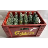 An ANTIQUE collection of 21 VINTAGE GLASS BOTTLES with MARBLE STOPPERS, some still retaining their