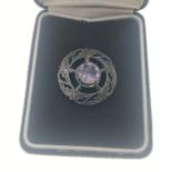 A SCOTTISH silver HALLMARKED vintage brooch with amethyst coloured stone 3cm diameter gross weight