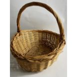 A STRAW BASKET 38cm diameter approx with handle