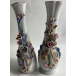 A pair of HIGHLY ORNATE vases standing 24cm high, one has sustained some slight damage with a