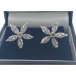 A BEAUTIFUL A pair of 18ct white and diamond flower shaped earrings