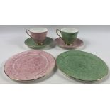 A pair of trios - ROYAL ALBERT GOSSAMER teacups, saucers and plates in pink and green