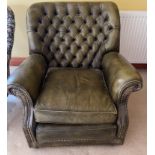 A nice green leather style deep buttoned ARMCHAIR with studs