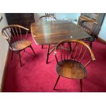 An ERCOL dining table complete with ERCOL tag dimensions 135cm x 112cm and four ERCOL style round