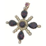 A VICTORIAN 'yellow metal' PENDANT in star shape form, with 4 large garnets 1cm in length, and