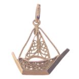 A 750 stamped yellow gold pendant shaped as a dhow length 3.25cm x 2.5cm, gross weight 2.9g