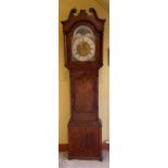 An over- sized Grandfather CLOCK with brass dial and Roman Numeral face with a hand painted rural