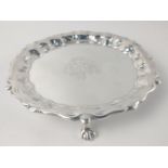 A London silver hallmarked 1746 CARD TRAY with crest in centre and scalloped edge by silversmith