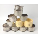 A collection of eleven NAPKIN RINGS to include 2 Birmingham 1925 silver hallmarked by silversmiths