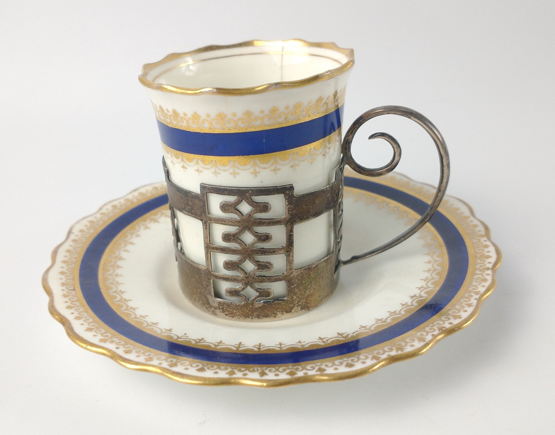 An AYNSLEY gilded COFFEE CAN and saucer with a silver WALKER & HALL, Sheffield hallmarked 1925 cup