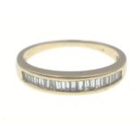 A half-eternity ring with baguette cut diamonds (tested as diamond) size L, gross weight 2g