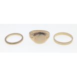 Three 9ct rings to include a man's signet ring size S and 2 wedding bands size J and N, gross