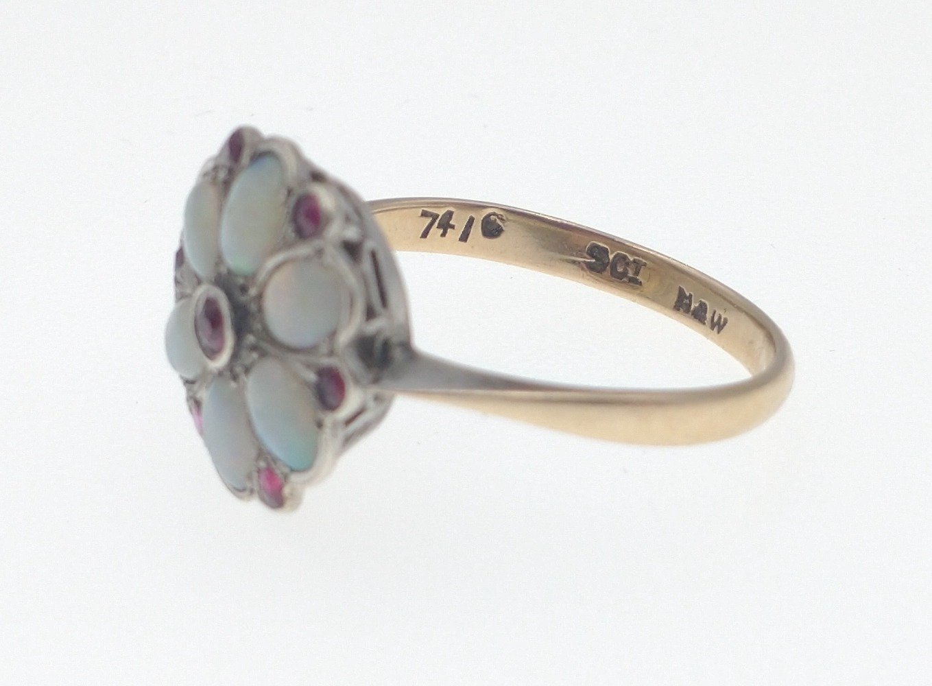 A 9ct gold opal ring with 6 opals and 7 red stones in a flower-head pattern, size M/N gross weight - Image 5 of 6