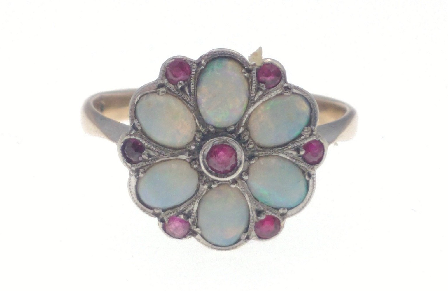 A 9ct gold opal ring with 6 opals and 7 red stones in a flower-head pattern, size M/N gross weight - Image 2 of 6