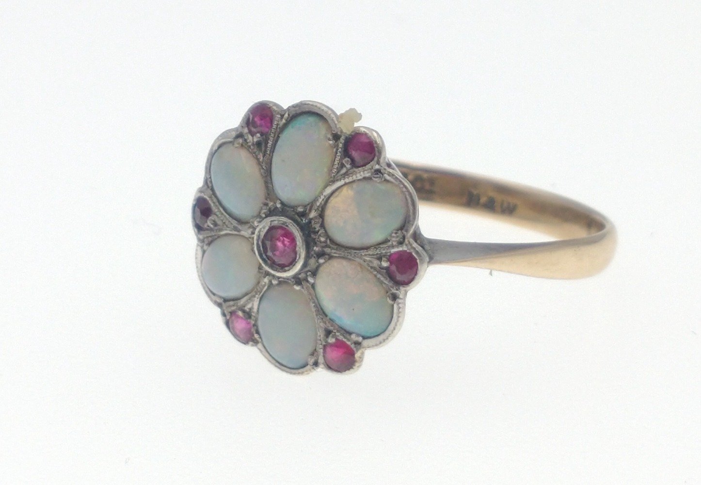 A 9ct gold opal ring with 6 opals and 7 red stones in a flower-head pattern, size M/N gross weight - Image 3 of 6