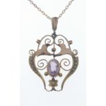 A VINTAGE 9ct stamped yellow gold ornate PENDANT with seed pearls flanking an amethyst on a 9k