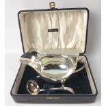 Boxed set of Sheffield sterling silver 1952 SAUCEBOAT (15.5cm x 9.5cm x 8.5cm) and LADLE (length