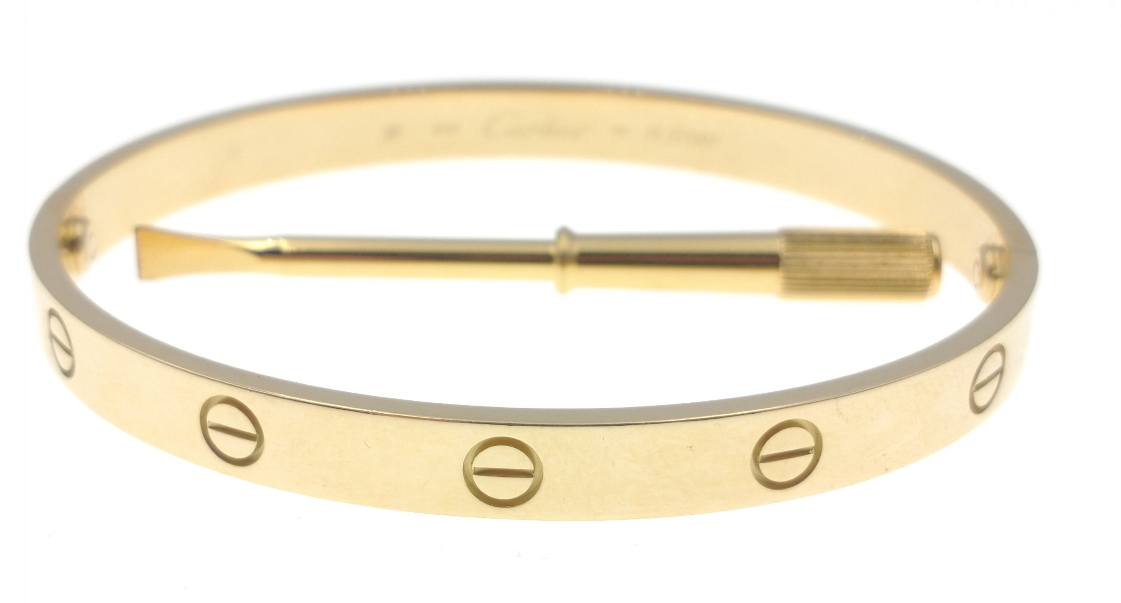 CARTIER 750 stamped yellow gold oval shaped 'LOVE BRACELET' with original key, dimensions 6.5cm x