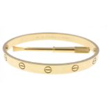 CARTIER 750 stamped yellow gold oval shaped 'LOVE BRACELET' with original key, dimensions 6.5cm x