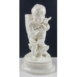 A decorative piece from BROWNFIELD of a boy holding a hare (one ear broken) and carrying a