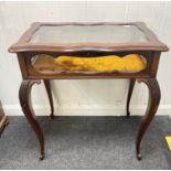 An elegant mahogany glazed hinged-lid and sides bijouterie/trinket display table on cabriole legs