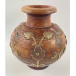 A most unusual CONTINENTAL studio-vase made from wood with bands of brass flowers, stands approx