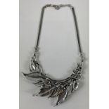 QUALITY! BOUTIQUE bought from YORK a Substantial handmade white metal TORQUE in leaf form with a
