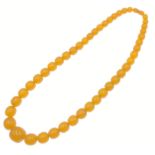 A strand of VINTAGE AMBER BEADS! This wonderful necklace is comprised of vibrant amber beads,