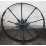 A SUBSTANTIAL ANTIQUE cast iron wheel - would make a nice garden feature - dimension 2ft diameter