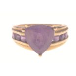 A STUNNING AND SUBSTANTIAL 9K stamped yellow gold ring with a large triangular-cut AMETHYST stone