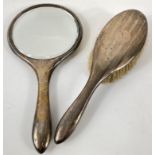 A Birmingham 1918 silver hallmarked hand mirror and brush gross weight 528gms