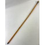 A VINTAGE Walking cane stick with a spherical hand grip made from rope - dimension 85cm - came