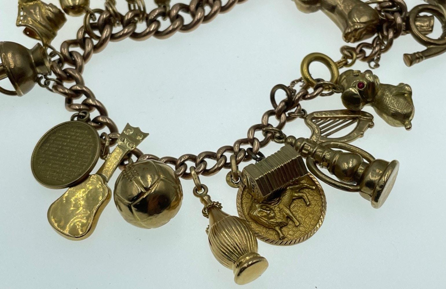 LOTS OF CHARMS!A 375 stamped gold charm bracelet , the 375 is partially rubbed, with most charms - Image 13 of 48