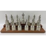 CROWN & ROSE CAST PEWTER BELLS OF JESUS and 12 APOSTLES including their wooden display stand -