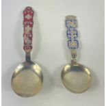 Two NORWEGIAN enamelled silver spoons, the first, red-handled, by J TOSTRUP, the second,