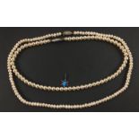 TWO STRINGS OF REAL PEARLSA nice string of real PEARLS with white metal clasp with three small