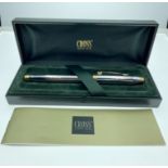 A top quality CROSS fountain pen in its presentation case with booklet, inscribed 'Maclay'