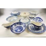A quantity of early 19th century blue and white serving dishes to include 2 lidded vegetable