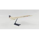 A model BA CONCORDE desk model bought on the plane itself by a passionate passenger, 25cm long