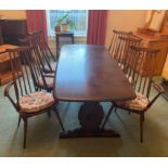 A VINTAGE LARGE ERCOL dining table with four chairs and two carvers - dimensions 6ft x 3ft wide