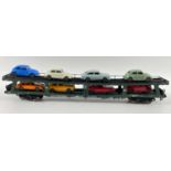 An unboxed FLEISCHMANN 5284 car transporter complete with 8 cars carefully stored in newspaper for
