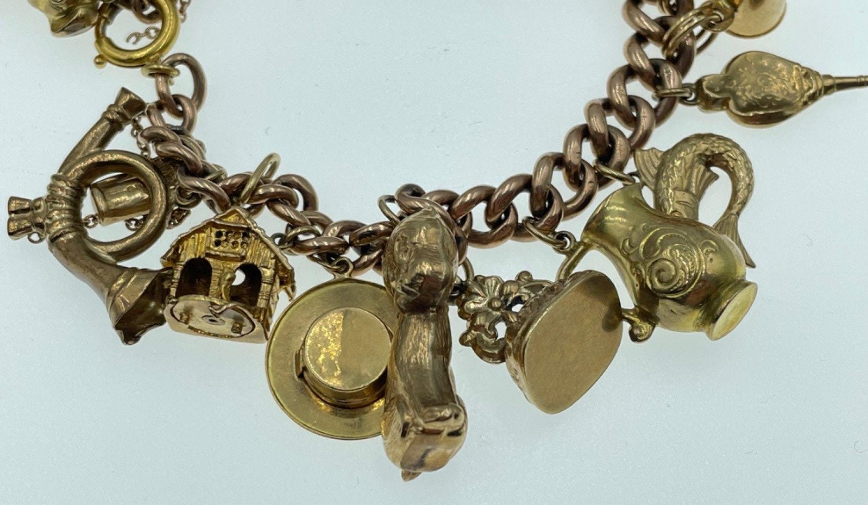 LOTS OF CHARMS!A 375 stamped gold charm bracelet , the 375 is partially rubbed, with most charms - Image 9 of 48