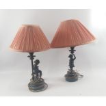 Two spelter table lamps with figurines of small dancing girls and peach shades standing approx