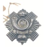 A HIGHLAND LIGHT INFANTRY SNCOs cap badge, hallmarked Sheffield silver King's Crown 1902-1952