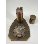 A WW2 1942 TRENCH ART table cigarette lighter made of a brass bullet on a brass stand with British