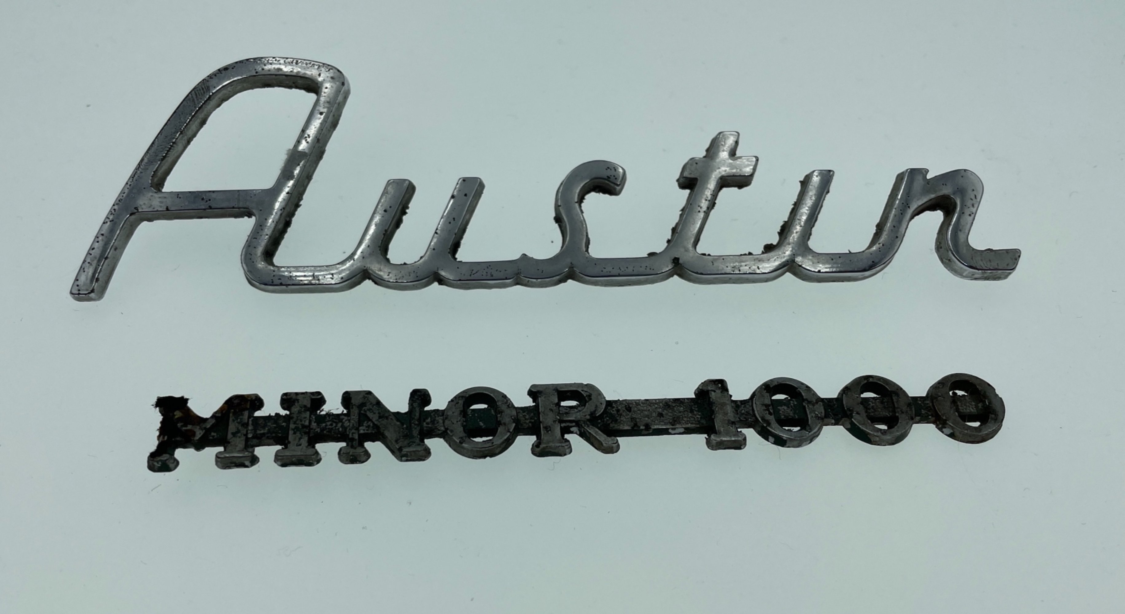 Two original VINTAGE car badges AUSTIN and MINOR 1000